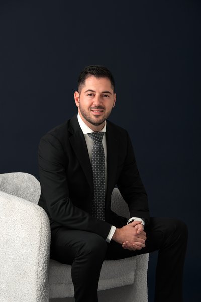 Agent George Tsiolas from Essendon
